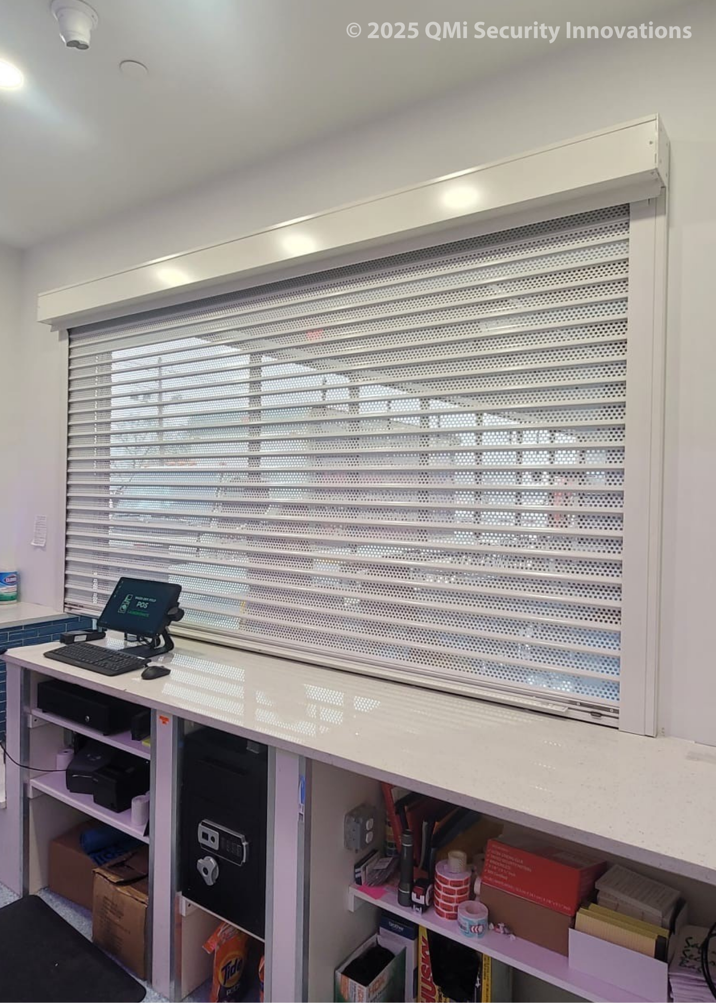 AL8 security shutters protect a countertop at a laundromat